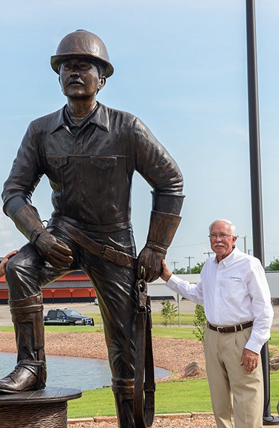 Stan Tunnell next to the Good Neighbor Statue at the time of its unveiling in 2016.