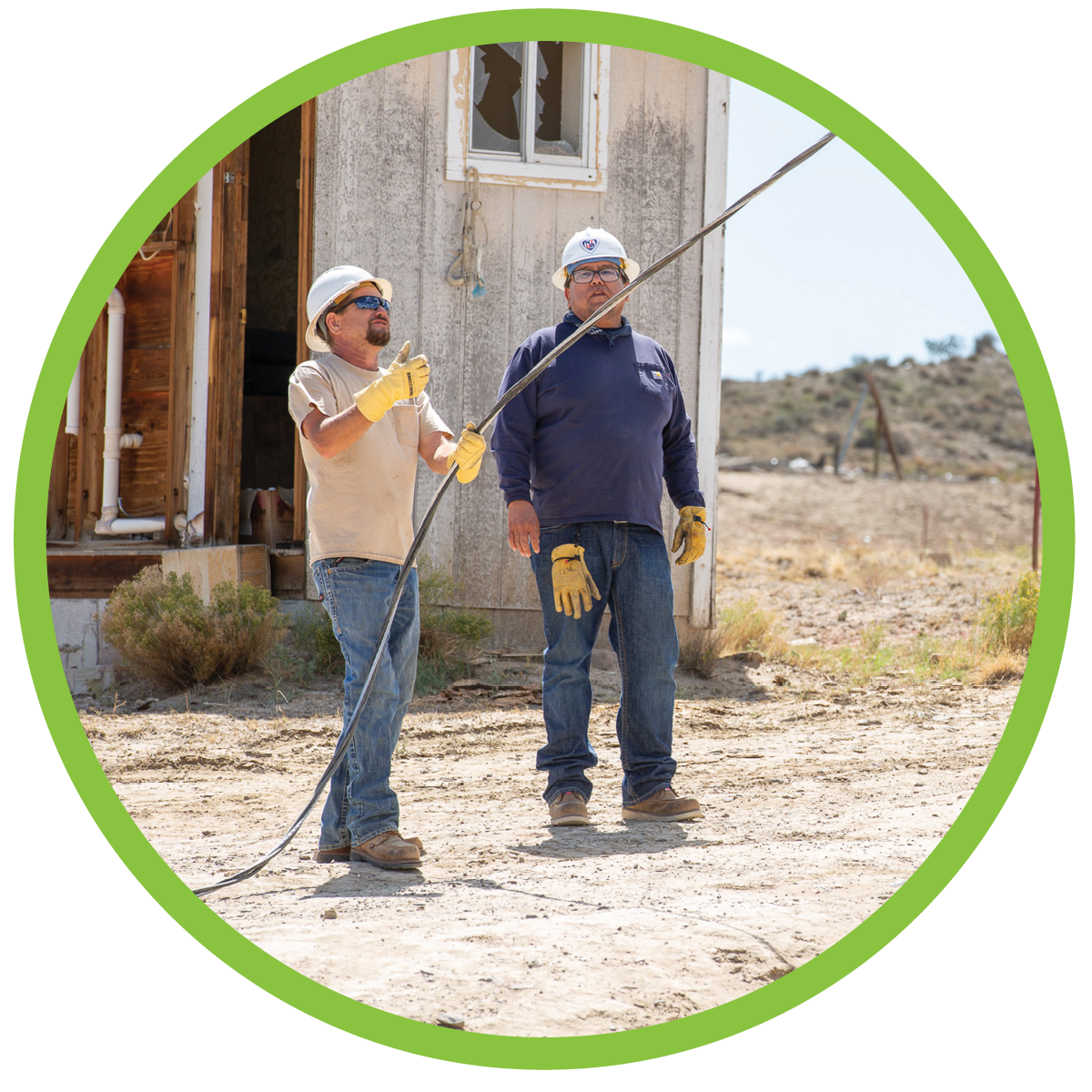 Central Lineman, Jason Cross, working during the Light Up Navajo Project
