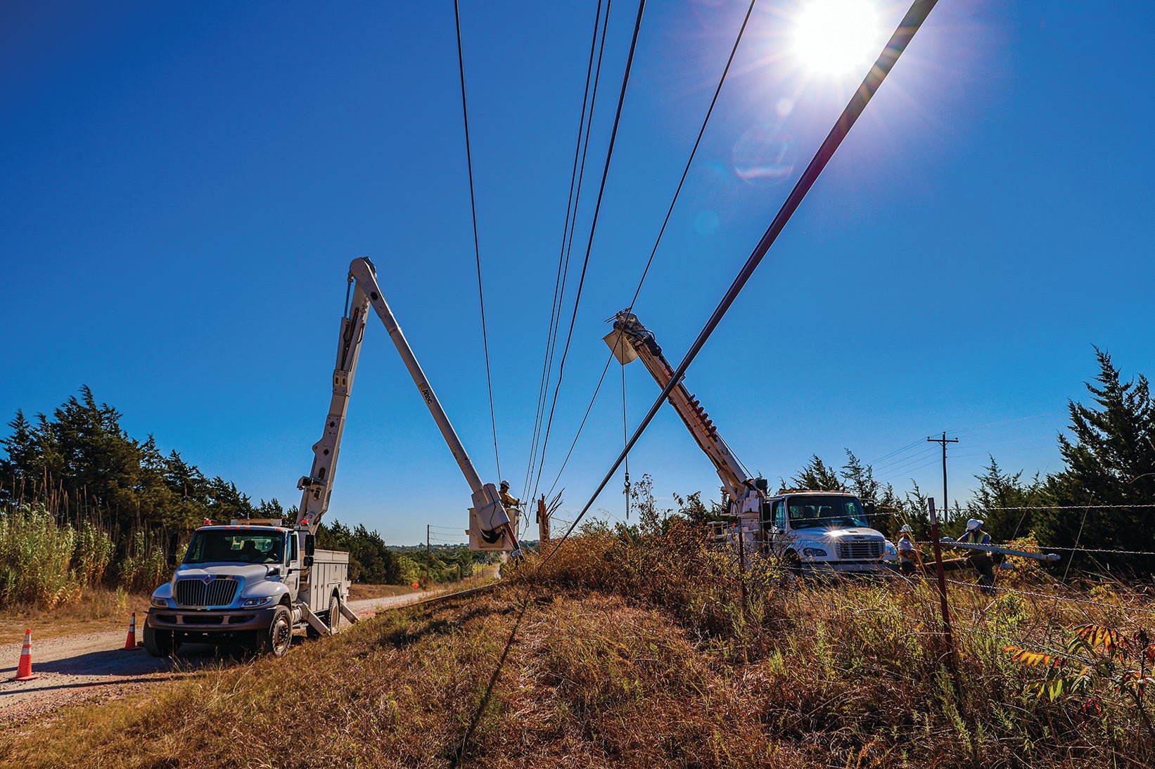 Central linemen working on electrical line