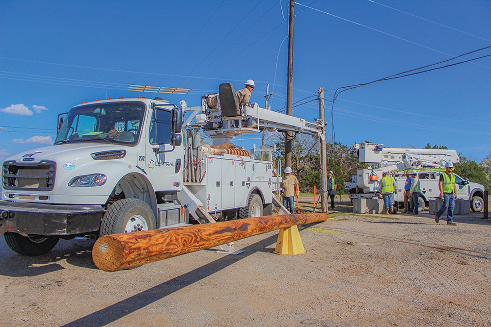 Central linemen working on a down line. 